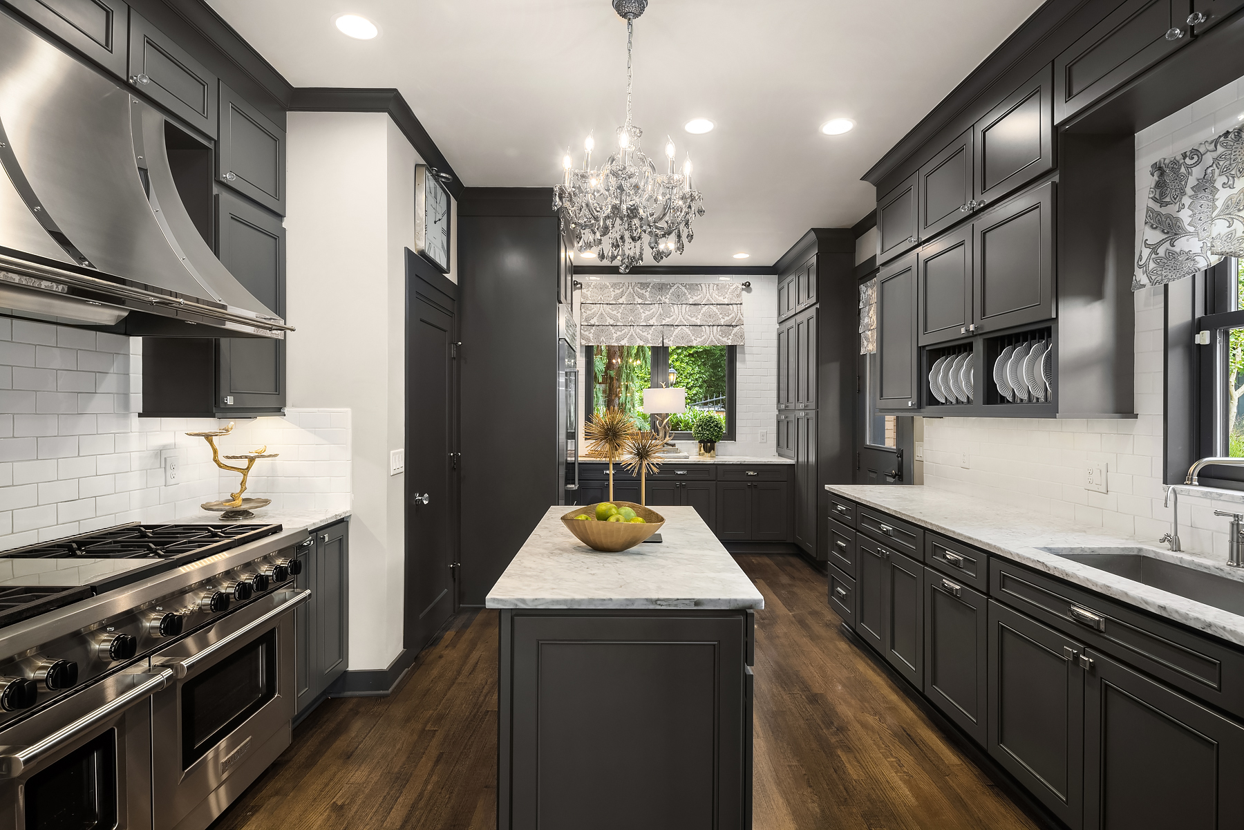 Elegant charcoal shaker kitchen with marble island and chandelier